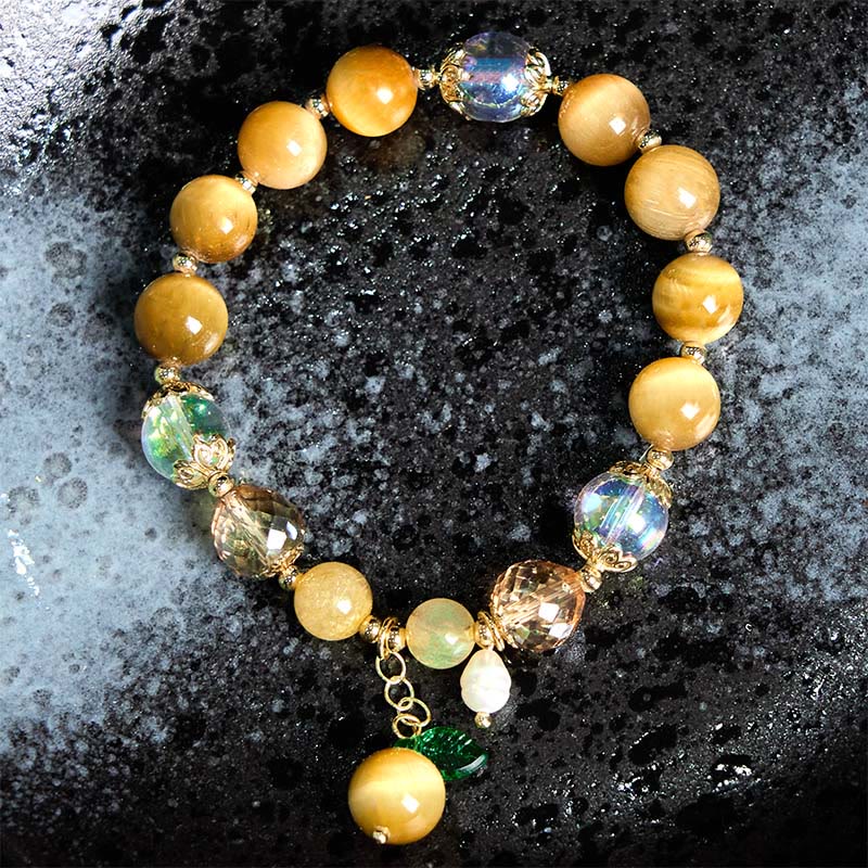 Buddha Stones Armband mit natürlichen Tigeraugen-Perlen und grünem Blattmotiv