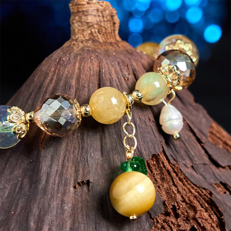 Buddha Stones Armband mit natürlichen Tigeraugen-Perlen und grünem Blattmotiv