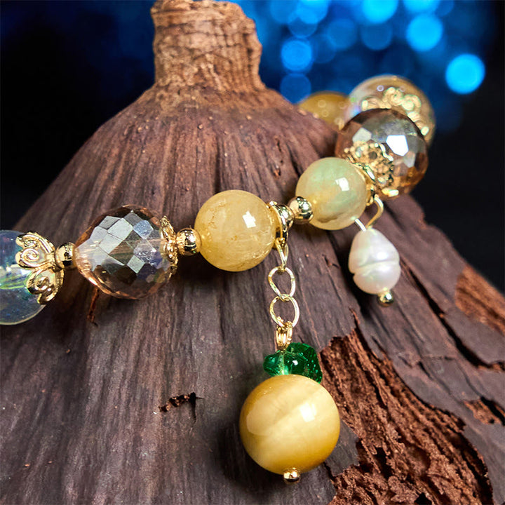 Buddha Stones Armband mit natürlichen Tigeraugen-Perlen und grünem Blattmotiv