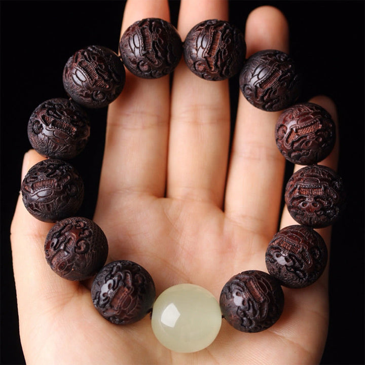 PiXiu Wärmearmband mit Buddha Stones und Gravur aus tibetischem Rosenholz - image 2