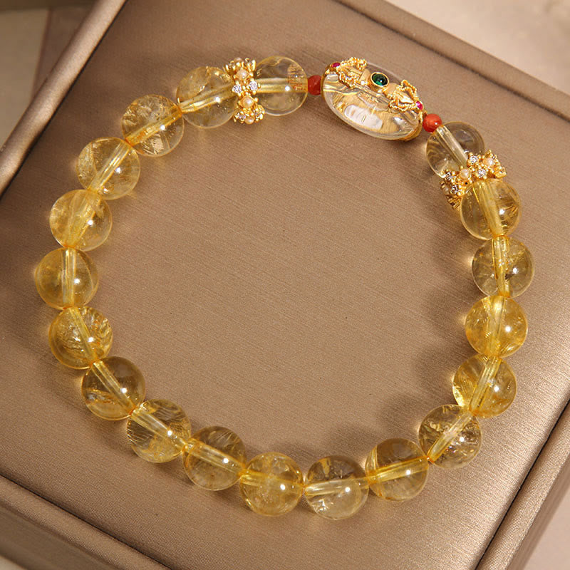 Buddha Stones Armband mit natürlichen goldenen Rutilquarzperlen und Glücksbringer