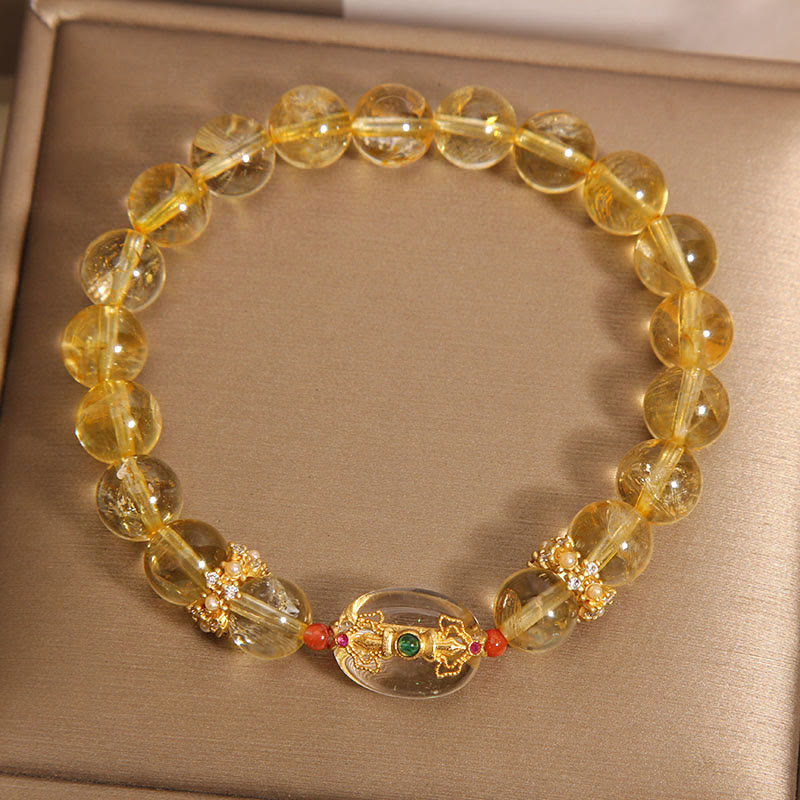 Buddha Stones Armband mit natürlichen goldenen Rutilquarzperlen und Glücksbringer