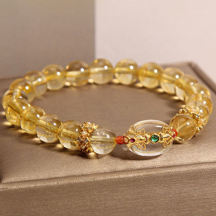 Buddha Stones Armband mit natürlichen goldenen Rutilquarzperlen und Glücksbringer
