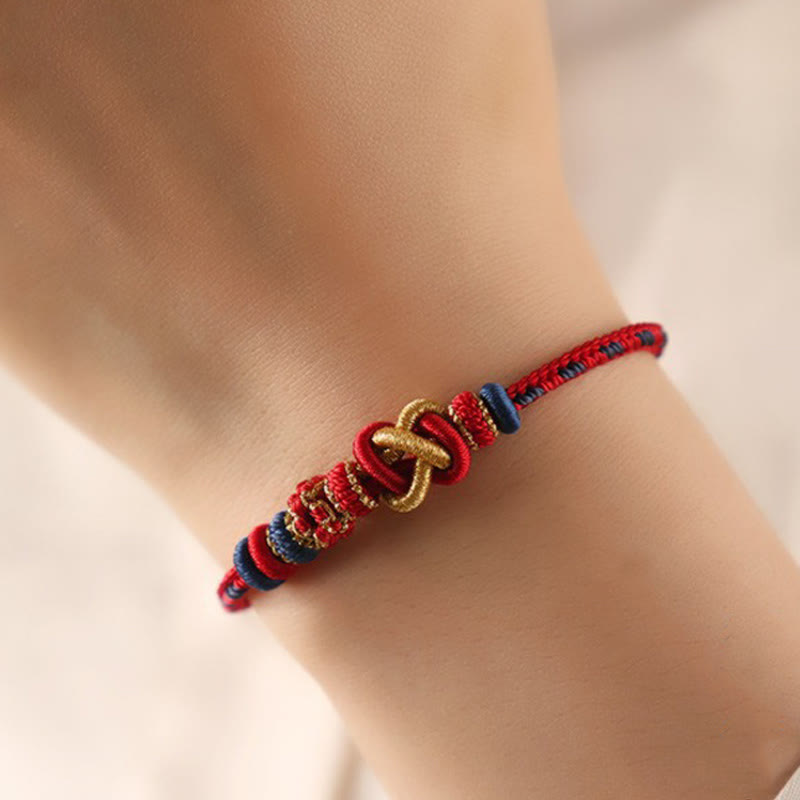 Buddha Stones Handgefertigtes Pfirsichblüten-Friedensknoten-Armband mit buntem Seil, verstellbar