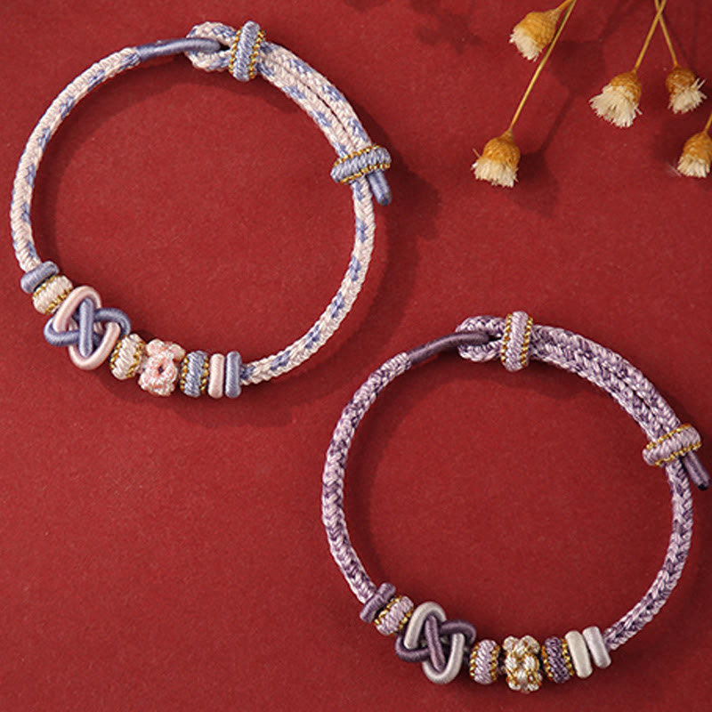 Buddha Stones Handgefertigtes Pfirsichblüten-Friedensknoten-Armband mit buntem Seil, verstellbar