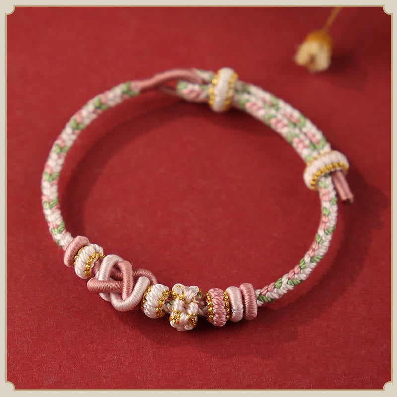 Buddha Stones Handgefertigtes Pfirsichblüten-Friedensknoten-Armband mit buntem Seil, verstellbar