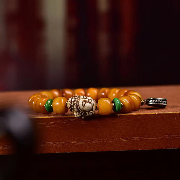 Buddha Stones Armband aus natürlichem tibetischem Kamelknochen, Fassperlen, Buddha-Kopf, Glücks- und Schutzsymbol