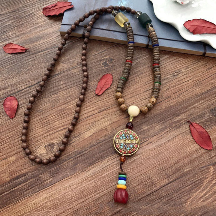Buddha Stones, tibetische handgefertigte Kokosnussschale, Schima-Holz, tolle helle Mantra-Kupferperlen, Balance-Halskettenanhänger