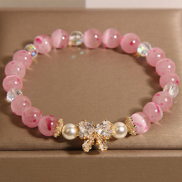 Buddha Stones Kirschblüten-Rosa Katzenaugen-Perlen-Stützarmband mit Schleife und Rosette