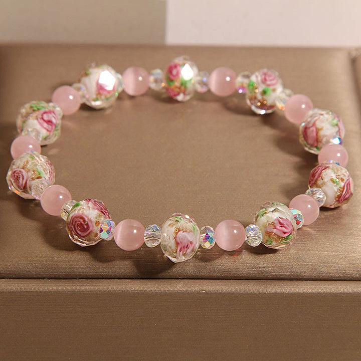 Buddha Stones Rosa Kristall Liuli Glasperlen Katzenauge Wärmearmband