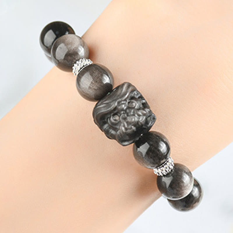Buddha Stones Schutzarmband mit natürlichem Silberglanz-Obsidian und Löwentanz