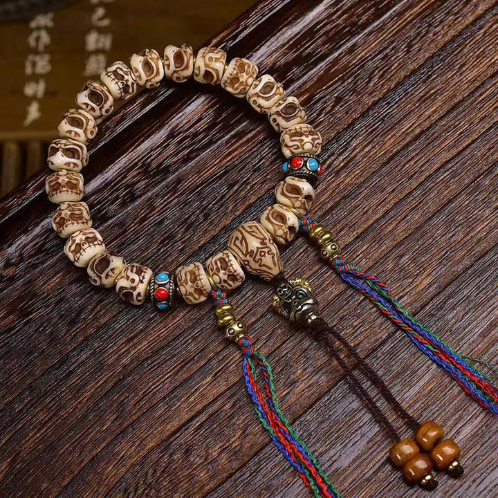 Armband mit Quaste aus tibetischem Kamelknochen und geschnitztem Garuda-Schutz aus Buddha Stones