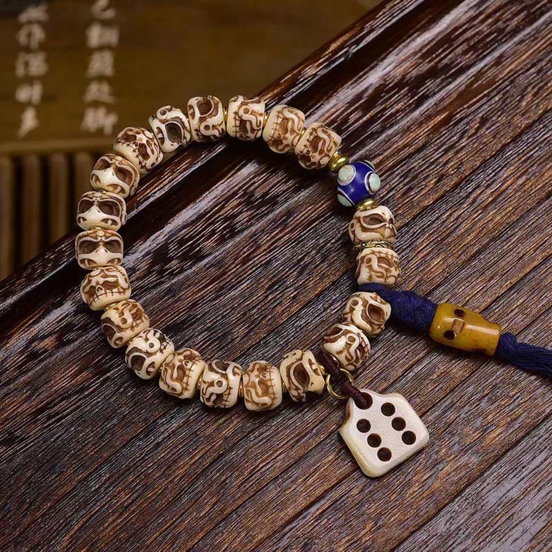Armband mit Quaste aus tibetischem Kamelknochen und geschnitztem Garuda-Schutz aus Buddha Stones