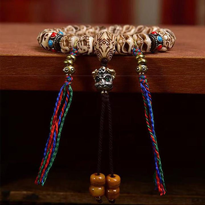 Armband mit Quaste aus tibetischem Kamelknochen und geschnitztem Garuda-Schutz aus Buddha Stones