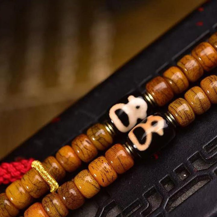 Buddha Stones Tibetische 108 Perlen Kamelknochen Glücksquaste Mala