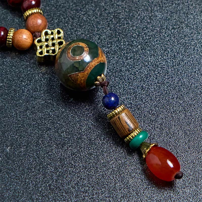 Buddha Stones, tibetische handgefertigte Wenge-Holz-Schutz-Dzi-Perle, Elefantenkopf-Halskettenanhänger