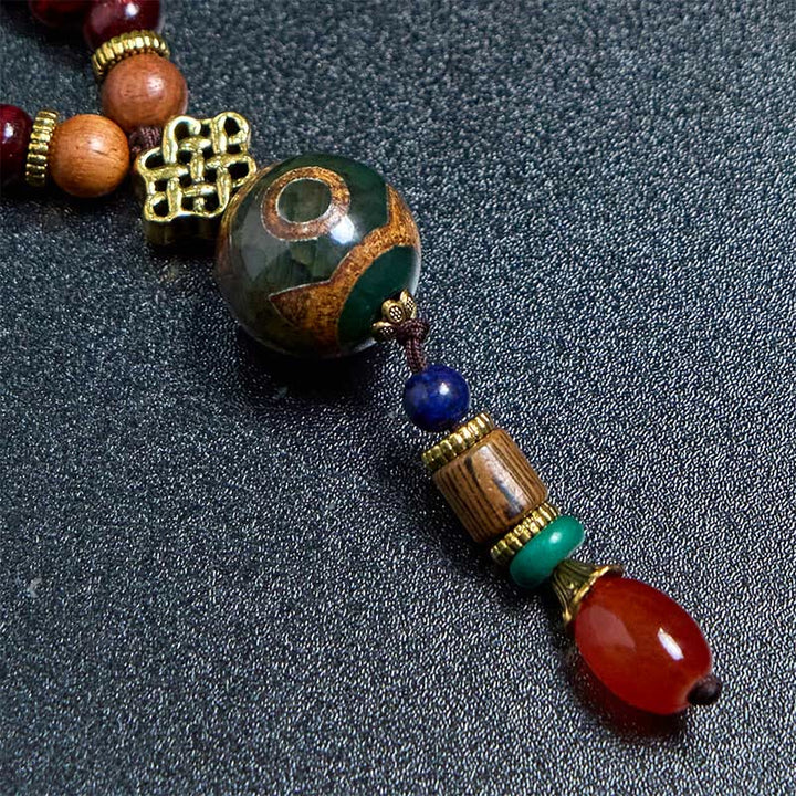 Buddha Stones, tibetische handgefertigte Wenge-Holz-Schutz-Dzi-Perle, Elefantenkopf-Halskettenanhänger