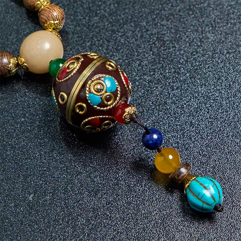Buddha Stones, tibetische handgefertigte Kokosnussschale, Schima-Holz, tolle helle Mantra-Kupferperlen, Balance-Halskettenanhänger