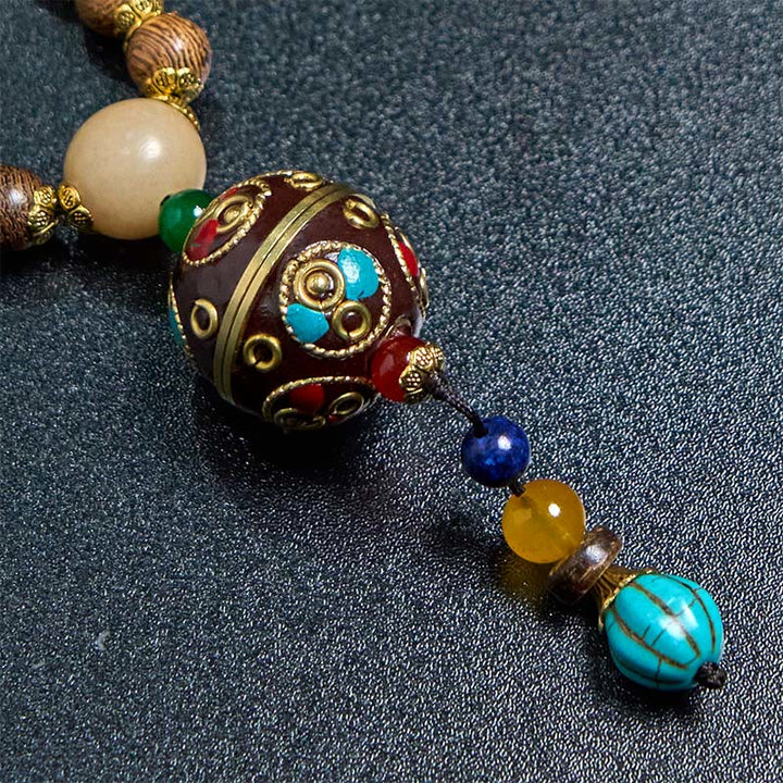 Buddha Stones, tibetische handgefertigte Kokosnussschale, Schima-Holz, tolle helle Mantra-Kupferperlen, Balance-Halskettenanhänger