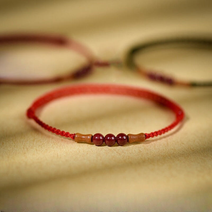 Buddha Stones Zinnoberperlen Pfirsichholz Segensschnur Armband
