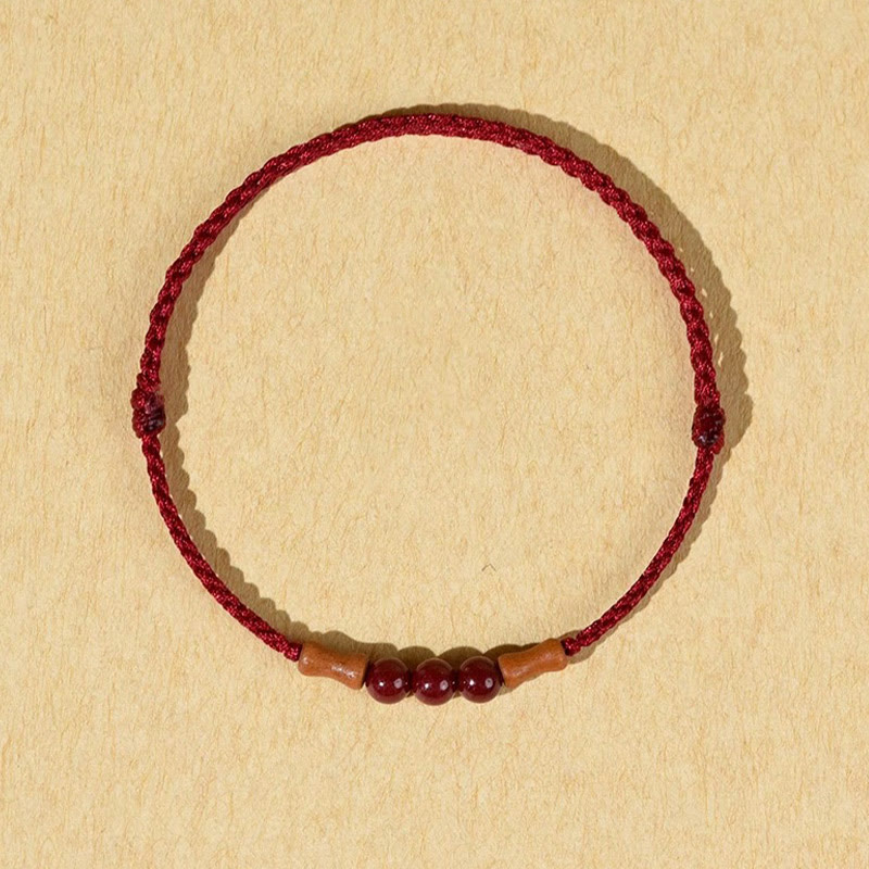 Buddha Stones Zinnoberperlen Pfirsichholz Segensschnur Armband
