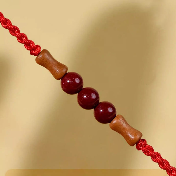 Buddha Stones Zinnoberperlen Pfirsichholz Segensschnur Armband