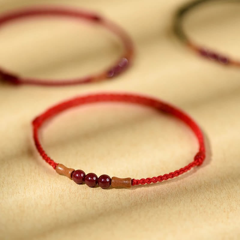 Buddha Stones Zinnoberperlen Pfirsichholz Segensschnur Armband