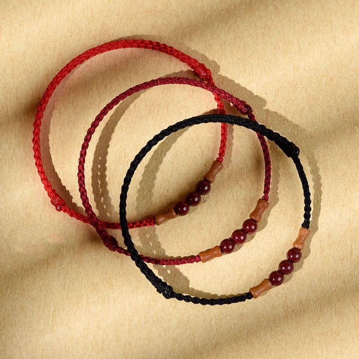 Buddha Stones Zinnoberperlen Pfirsichholz Segensschnur Armband
