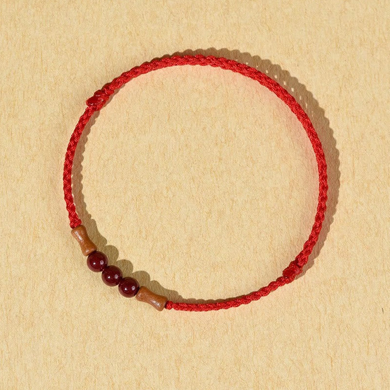 Buddha Stones Zinnoberperlen Pfirsichholz Segensschnur Armband