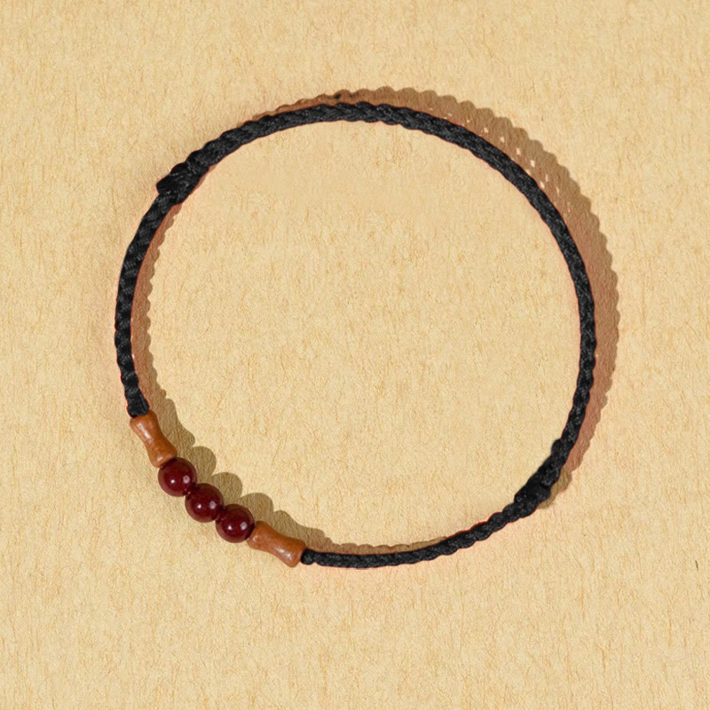 Buddha Stones Zinnoberperlen Pfirsichholz Segensschnur Armband