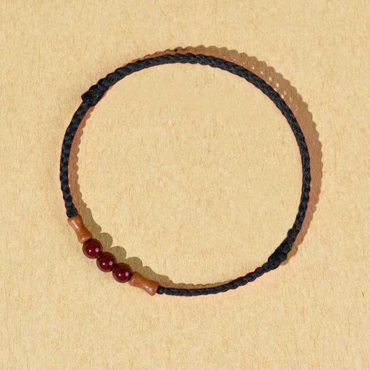 Buddha Stones Zinnoberperlen Pfirsichholz Segensschnur Armband