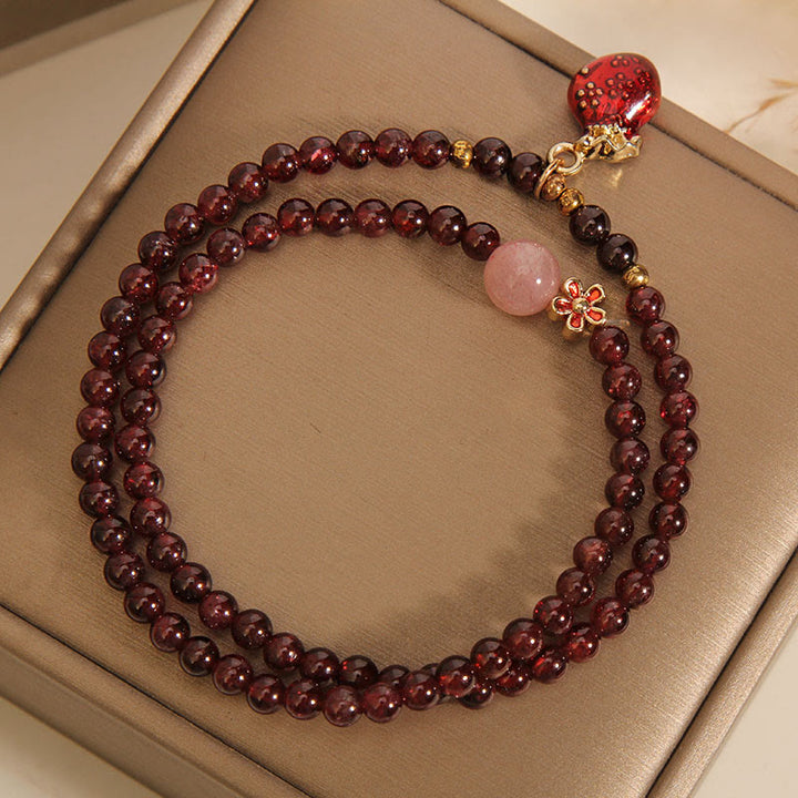 Buddha Stones Natürliches 3 mm ultradünnes Granat-Rosenquarz-Perlen-Geldbeutel-Glockenblumen-Schutzarmband