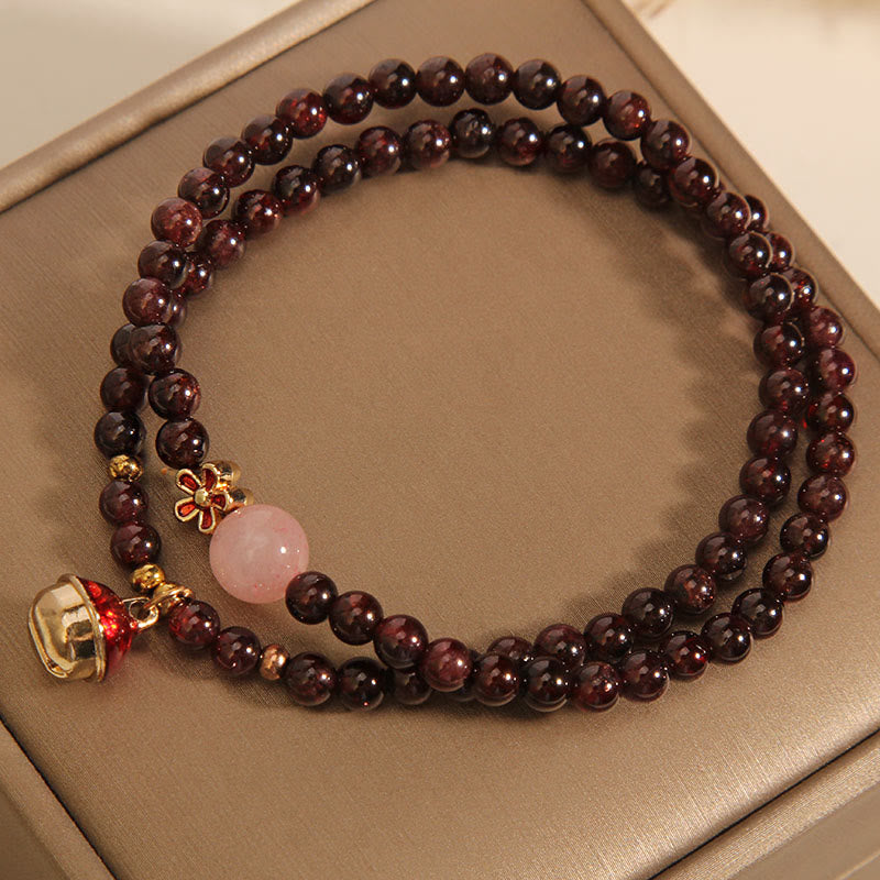 Buddha Stones Natürliches 3 mm ultradünnes Granat-Rosenquarz-Perlen-Geldbeutel-Glockenblumen-Schutzarmband