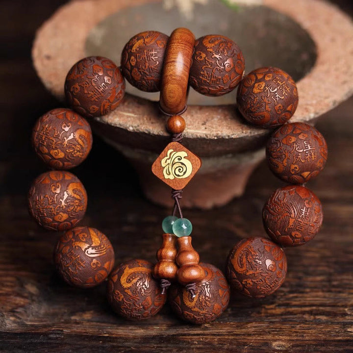 Buddha Stones Natürliche Schnitzerei Drache und Phönix Fu Charakter Kürbis Rosenholz Perlen Wärme Armband
