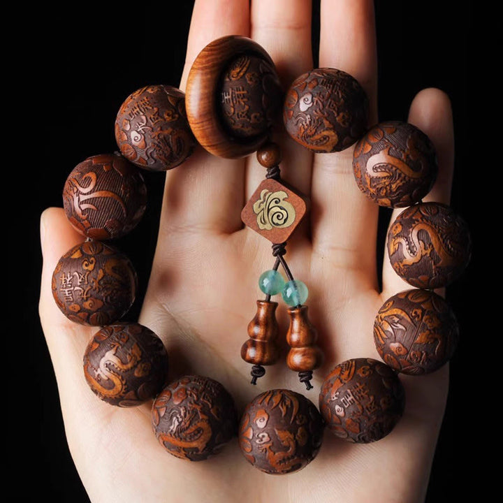 Buddha Stones Natürliche Schnitzerei Drache und Phönix Fu Charakter Kürbis Rosenholz Perlen Wärme Armband