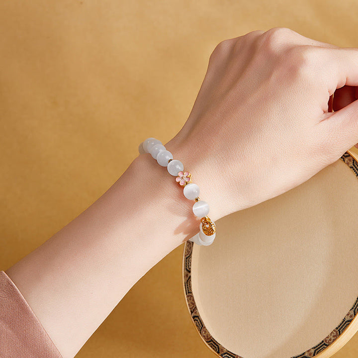 Buddha Stones 925 Sterling Silber Natürliche Pfirsichblüte Weißes Katzenauge Positives Armband