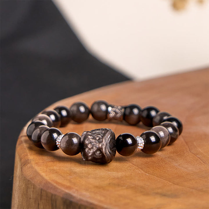 Buddha Stones Schutzarmband mit natürlichem Silberglanz-Obsidian und Löwentanz