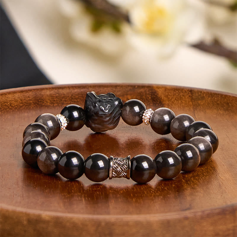 Buddha Stones Schutzarmband mit natürlichem Silberglanz-Obsidian und Löwentanz