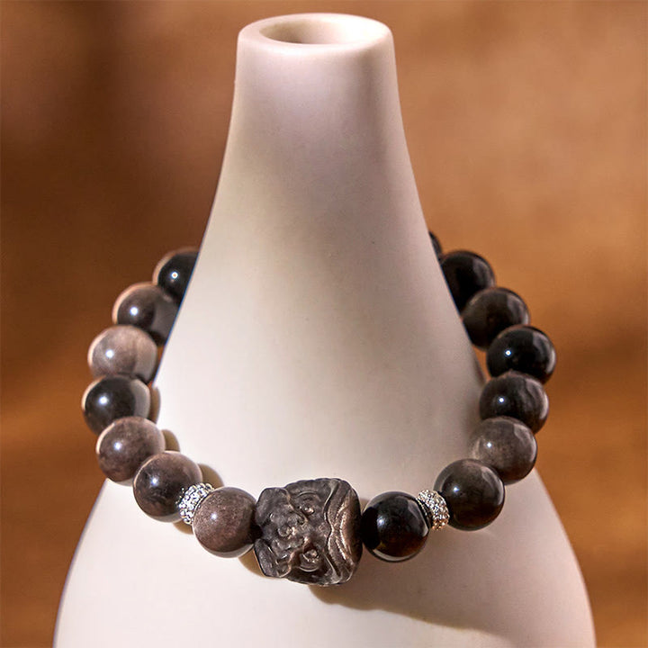 Buddha Stones Schutzarmband mit natürlichem Silberglanz-Obsidian und Löwentanz