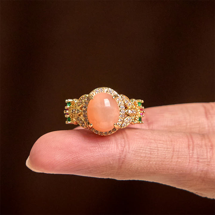 Buddha Stones Vintage-Ring mit Krappenfassung, vierblättriges Blumendesign, Pfirsichmondstein, verstellbar, beruhigend