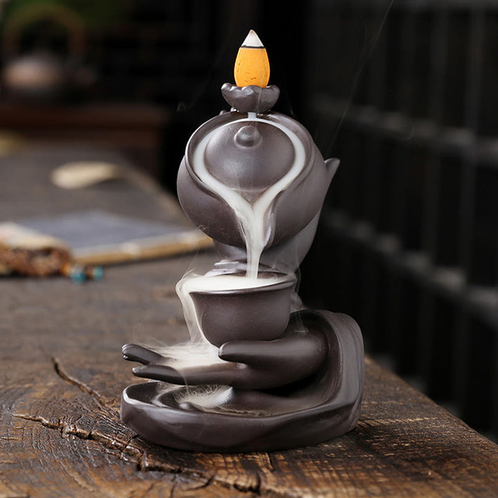Buddha Stones, Buddha-Hand, die Teekanne und Tasse hält, Keramik-Rückfluss-Rauchbrunnen, heilende Weihrauchbrenner-Dekoration - image 1