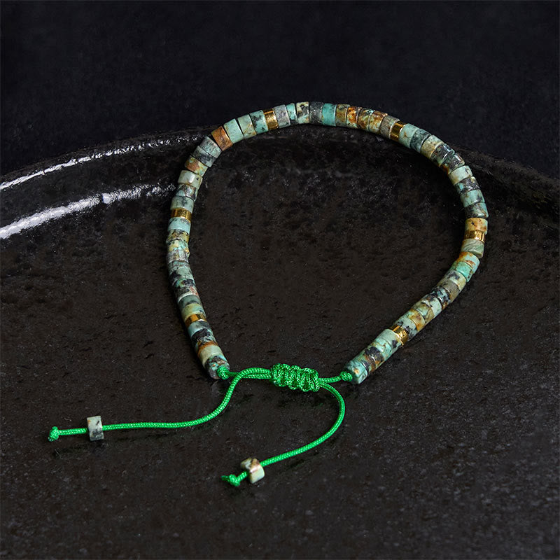 Armband mit türkisfarbenen Buddha Stones und Zwischenperlen zur Reinigung