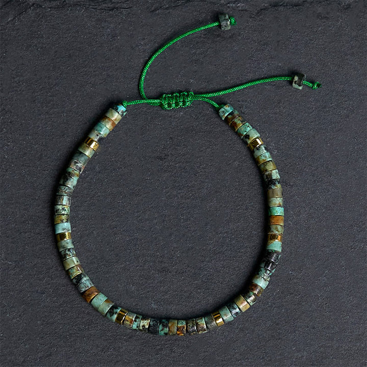 Armband mit türkisfarbenen Buddha Stones und Zwischenperlen zur Reinigung
