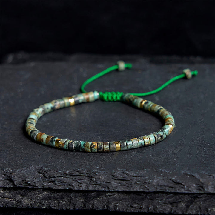 Armband mit türkisfarbenen Buddha Stones und Zwischenperlen zur Reinigung