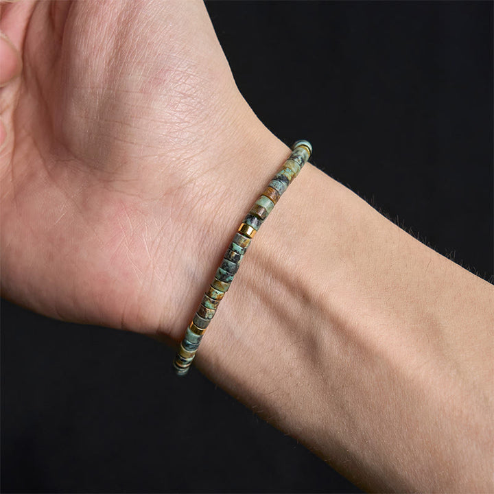 Armband mit türkisfarbenen Buddha Stones und Zwischenperlen zur Reinigung