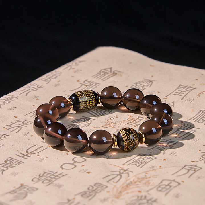 Buddha Stones Eisobsidian Sanskrit-Mutarmband mit Goldprägung