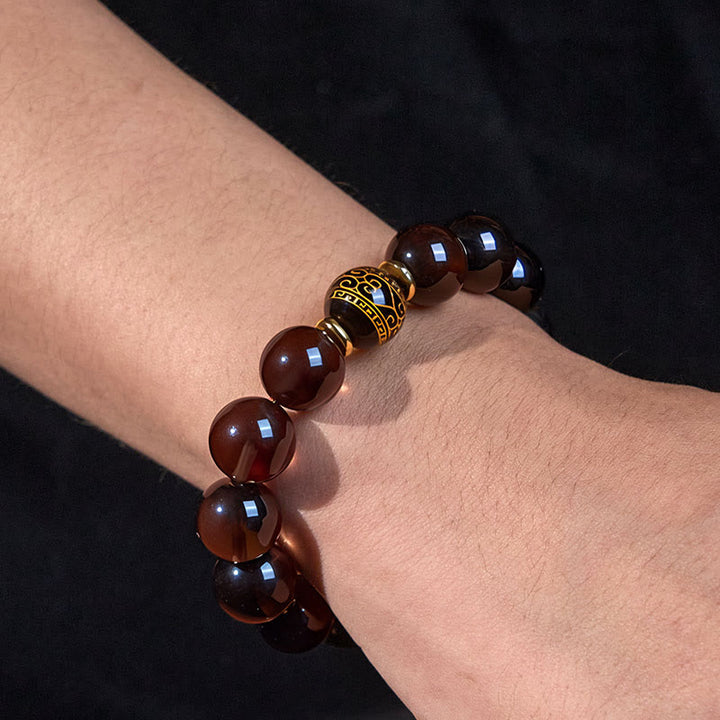 Buddha Stones Eisobsidian Sanskrit-Mutarmband mit Goldprägung