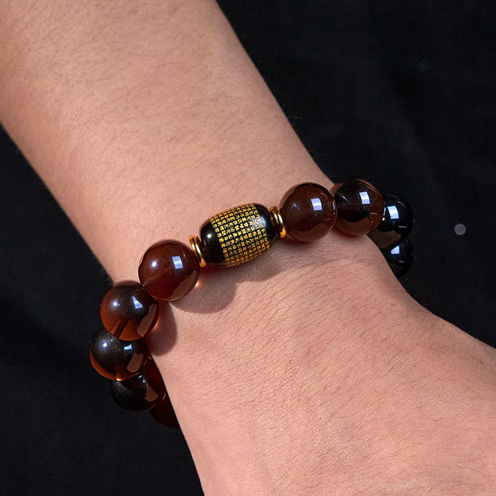Buddha Stones Eisobsidian Sanskrit-Mutarmband mit Goldprägung