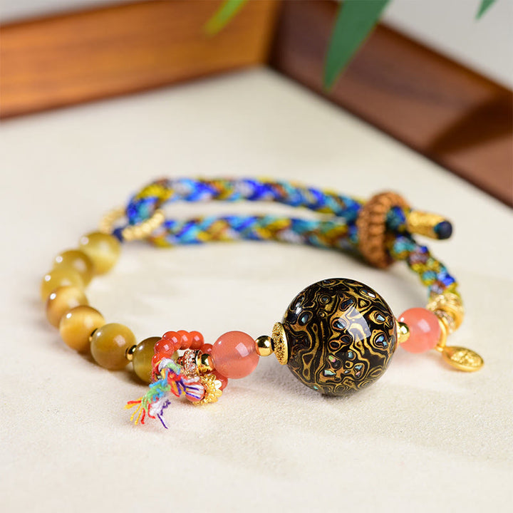 Buddha Stones Tibetische Lackperle Handgewebtes Tigerauge-Stein-Schutzarmband - image 1