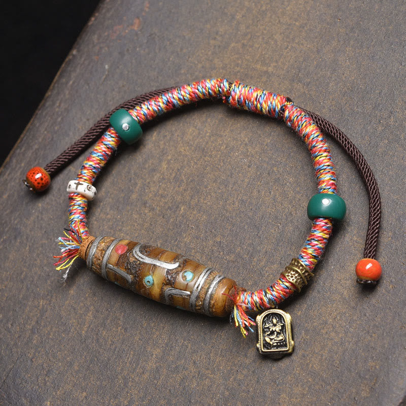 Handgefertigtes tibetisches Neun-Augen-Dzi-Perlen-Schutzseilarmband aus Buddha Stones - Farbige Seile und Neun-Augen-Dzi-Perle (Handgelenkumfang: 16–20 cm) - image 0